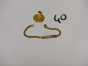 1 bracelet cassé en or et une médaille religieuse en or. PB 9,1g