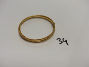 1 Semainier en or tenu par une barrette (Diamètre 6,5cm). PB 28,9g
