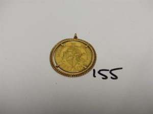 1 Pendentif en or orné d'une pièce caciques de Venezuela. PB 26,7g