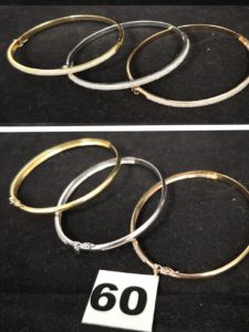 3 Bracelets rigides ouvrants en or jaune , rose et gris pavés de pierres sur la moitié. PB 20,3g