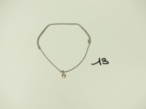 1 Chaîne en or maille tréssée et son pendentif orné d'un petit diamant (L44cm). PB 5g