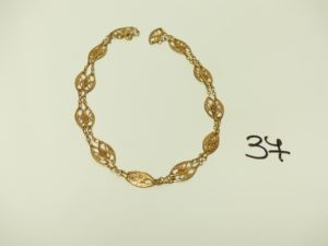 1 Collier en or à motifs filigranés (L70cm). PB 13,9g