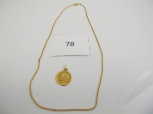 1 Chaine en or (L48cm),1 médaille en or de la vierge.PB 8,9g.