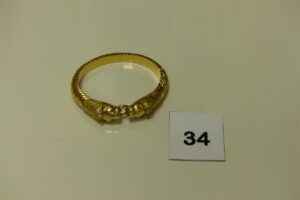 1 bracelet rigide ouvrant en or à décor de 2 têtes de panthères ornées de petites pierres (diamètre 6/7cm). PB 51,9g