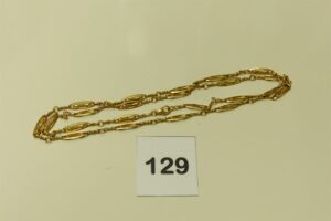 1 collier ou sautoir en or à motifs filigranés (L81cm). PB 35g