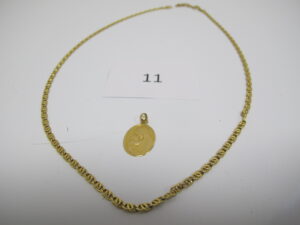 1 Chaine en or maille fantaisie (L50cm),1 pendendentif médaille de la vierge en or.PB 8,46 g.