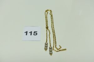 1 Collier en or maille articulée ornée de 2 motifs à décor de boules en or poli et granité (L50cm). PB 14,7g