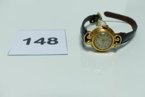 1 Montre pour dame boitier or de marque suisse bracelet en cuir, boucle en métal. PB 11,6g
