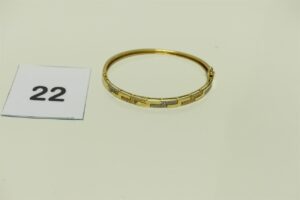 1 Bracelet en or 750/1000 rigide et ouvrant orné de pierres (Diamètre 6cm). PB 11,6g