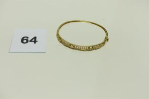 1 Bracelet en or 750/1000 rigide et ouvrant orné de pierres (fragile, Diamètre 6cm). PB 7,7g