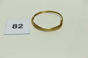 1 Bracelet en or 750/1000 rigide et ouvrant cassé. PB 8,7g