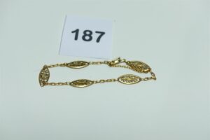 1 Bracelet à motifs filigranés en or 750/1000 (avec sécurité, L 20cm). PB 7,2g