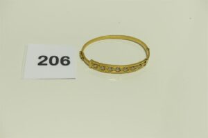 1 Bracelet bicolore rigide et ouvrant en or 750/1000 (cabossé, diamètre 6cm).PB6,8g