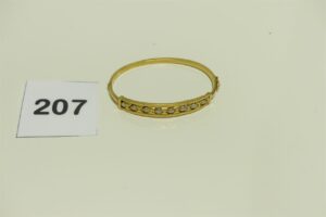 1 Bracelet bicolore rigide et ouvrant en or 750/1000 (cabossé, diamètrre 6cm).PB 7g