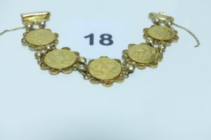 1 bracelet articulé à motif filigrané et serti de motifs ouvragés (sécurité cassé,L18cm). Le tout en or 750/1000. PB 24,6g