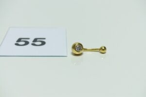 1 piercing en or 750/1000 orné d'un petit diamant d'environ 0,10 cts. PB 2g
