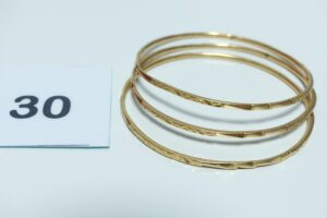 3 bracelets rigides ouvragés en or 750/1000 (diamètre 6cm). PB 25,7g