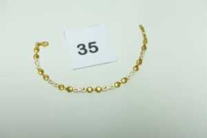 1 bracelet maille articulée en or 916/1000 orné de petites pierres (quelques chatons vides (L19cm). PB 8,5g