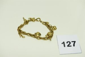 1 bracelet souple en or 750/1000 orné de 6 breloques (2 coeurs,1 trèfle,1 poisson,1 chaussure,1 éléphant)(manque 1 breloque). PB 14,2g