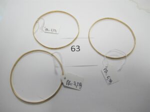 3 Bracelets en or 18k(750/1000)ouvragés (6,5cm).PB 21,86g.