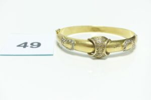 1 Bracelet rigide et ouvrant orné de pierres (Diamètre 6,5cm) en or 750/1000. PB 21,4g