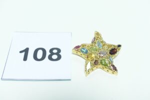 1 Pendentif à décor d'une étoile ornée de pierres de couleur en or 750/1000. PB 8,8g