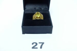 1 bague monture filigranée en or 750/1000 rehaussée d'une pierre jaune (Td53). PB 5,2g