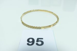 1 bracelet rigide mi-ouvragé en or 750/1000 (diamètre 6,5cm). PB 14,2g