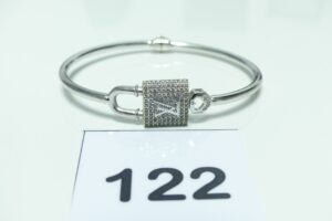 1 bracelet en or 750/1000 à décor d'un cadenas orné de petites pierres (diamètre 5,5/6cm, ouvrant). PB 11,3g