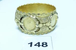 1 bracelet esclave ouvragé en or 750//1000 (diamètre 6,5cm). PB 28,8g