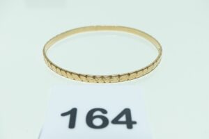 1 bracelet rigide et ouvragé en or 750/1000 (diamètre 6cm). PB 11,9g