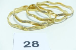 4 Bracelets rigides à décor bicolore en or 916/1000 (22k) (diamètre 6,8cm). PB 42,7g