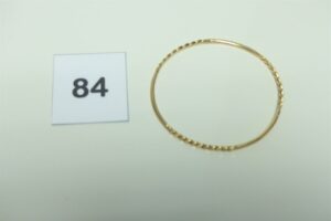 1 Bracelet jonc en or 750/1000 semi-torsadé (Diamètre 7cm). PB 8,4g