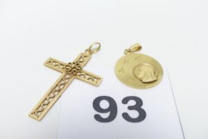 1 Croix ouvragée (H4cm) et 1 médaille de la Vierge. Le tout en or 750/1000 PB 6,6g