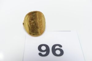 1 Bague en or 750/1000 sertie d'une pièce de 20frs retournée (Td55). PB 7,7g