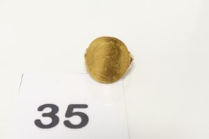 1 Bague en or 750/1000 18k, sertie d'une pièce de 10frs NAPIII en or 900/1000 21,6k (td57). PB 4,8g