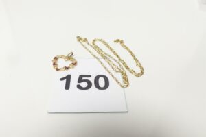 1 Chaîne fine maille alternée (L44cm) et 1 pendentif coeur à motifs émaillés. Le tout en or 750/1000 PB 2g.