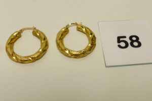 1 Paire de créoles torsadées en or 750/1000 18k (un peu cabossées). PB 3,1g