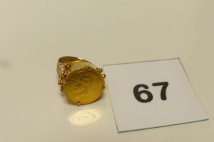 1 Bague monture en or 585/1000 14k, motif central en or 875/1000 21k (td54). PB 7,7g