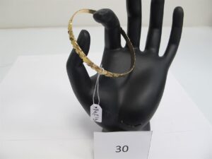 1 Bracelet rigide ouvragé or 18k(750/1000)(D6,5cm).PB 14,21 g.