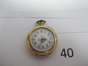 1 Montre de poche en or 18k(750/1000) HS attention belière en métal.PBT or 18k(750/1000) et mécanisme en métal 17,69g (poinçon tête de cheval).