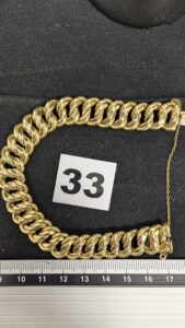 1 Bracelet maille américaine avec chainette de sécurité, (L18cm) en or 750/1000 18k. PB 26,26g