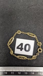 1 Bracelet maille alternée filigranée (L14,5cm)en or 750/1000 18k. PB 4,1g