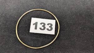 1 Jonc tordu (Diam env 6/6,5cm) en or 750/1000 18k. PB 9,27g