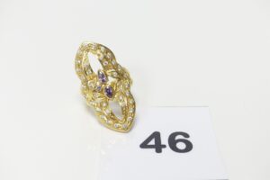 1 bague en or 750/1000 18 k ornée de pierres blanches et violettes (Td58). PB 7,2g
