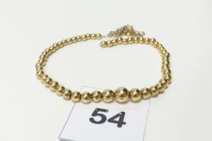 1 collier boules en or 750/1000 monté sur chainette en métal (détérioré). PB 14g