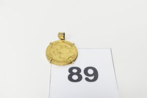 1 Pendentif en or 750/1000 serti-griffes 1 pièce de 20frs NapIII B1869. PB 7,7g