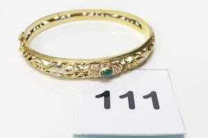 1 Bracelet rigide ouvranten or 750/1000 18k, motif central à décor floral orné de quelques petites pierres (diamètre 5,5/6cm). PB 20,4g