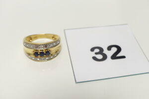 1 Bague en or bicolore 750/1000 ornée de 3 petites pierres bleues (Td57). PB 4,3g