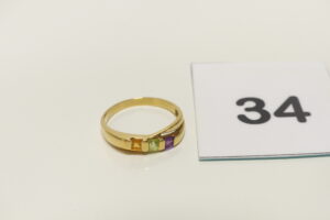 1 Bague en or 750/1000 ornée de 3 petites pierres de couleur (Td57). PB 2,6g